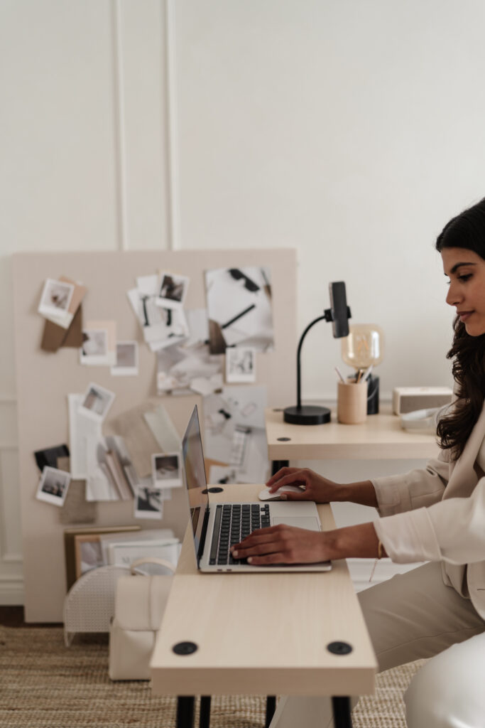 Hunted Aesthetic team member typing on laptop
